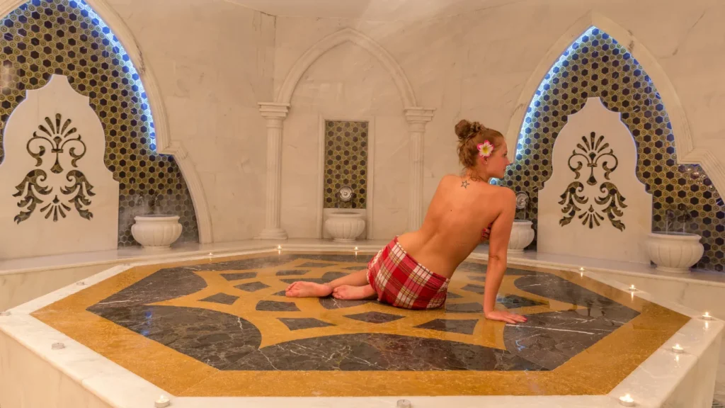 Foam massage on marble slab during hammam ritual