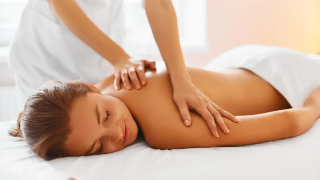 Client receiving aromatherapy massage in peaceful environment
