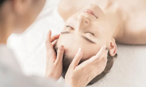 Therapist performing holistic massage at Victory Spa