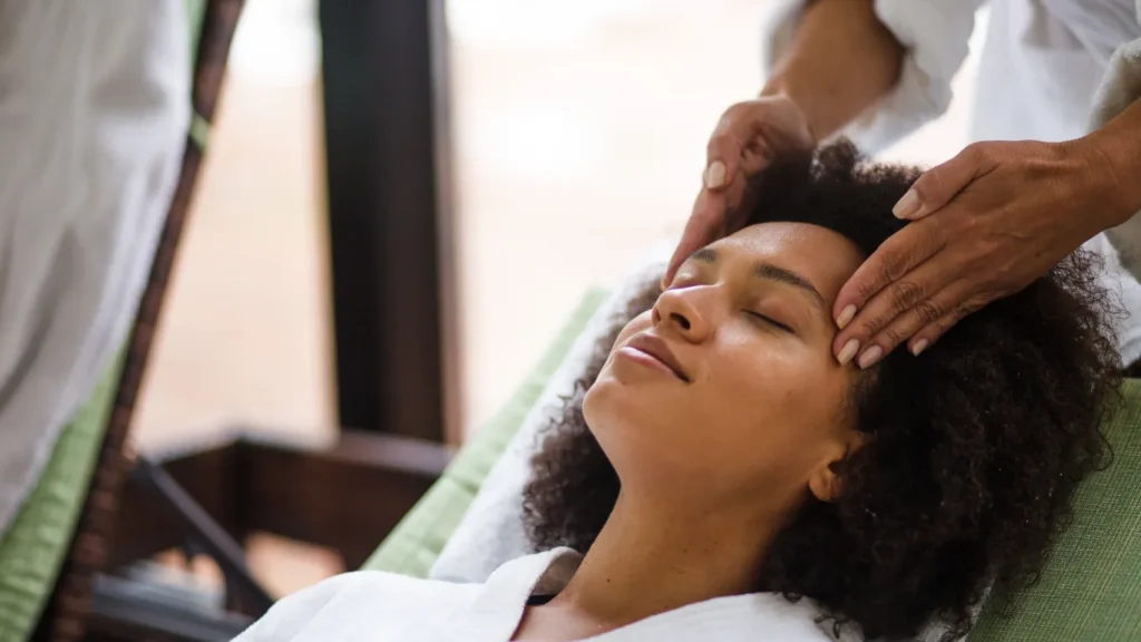 Client receiving Swedish massage in serene spa room