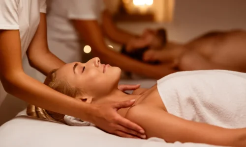 Couple receiving side-by-side massage at Victory Spa