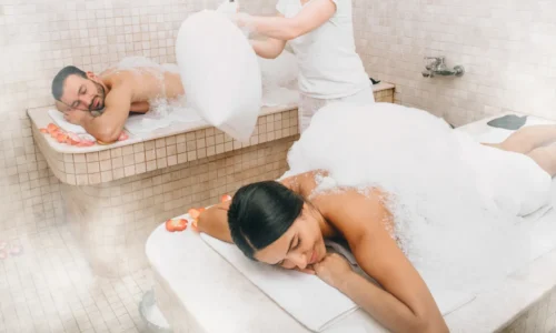 Couple enjoying romantic hammam in Istanbul with rose petals