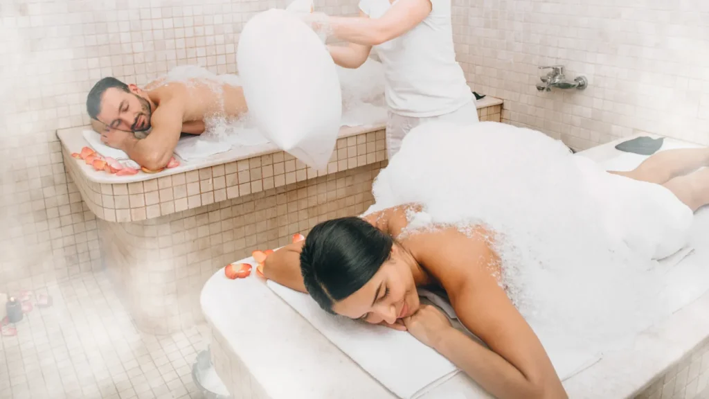 Couple enjoying hammam spa with rose petals at Victory Spa
