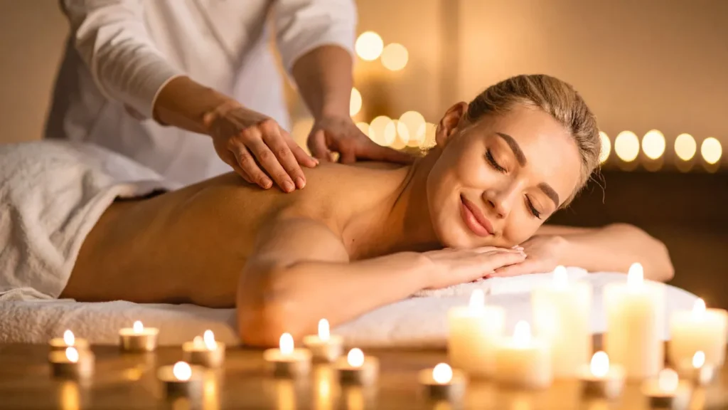 Therapist performing aromatherapy massage with oils