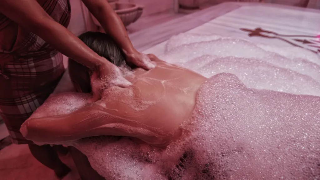 Couple enjoying Turkish hammam in Istanbul with rose petals