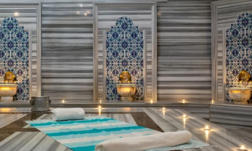 Traditional Turkish hammam interior with marble and steam.