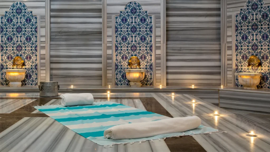 Traditional hammam interior with marble dome and warm light.